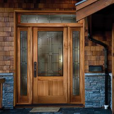 a wooden door with glass panels on the outside