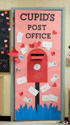 a red mailbox sitting on top of a bulletin board