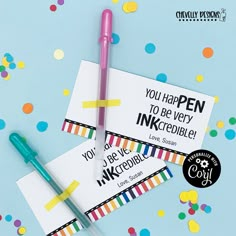 two pens are sitting on top of some cards with confetti around them and the words you happen to be very inkcreibeble