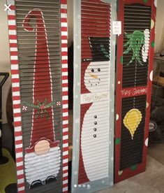 two snowmen made out of shutters sitting next to each other