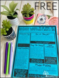 a blue menu sitting on top of a table next to potted plants and markers