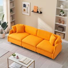 a living room filled with furniture and a white rug on the floor in front of a window