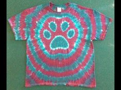 a tie dye shirt with a dog's paw on it