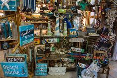 there are many items on display in the store, including signs and other things for sale