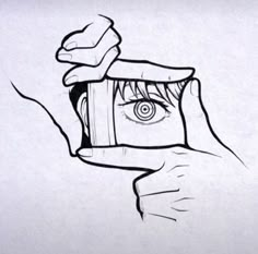 a drawing of a hand holding an object with the eye in it's center