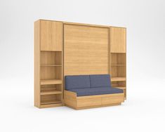 a blue couch sitting in front of a wooden bookcase with shelves on both sides