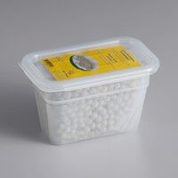 a plastic container filled with lots of white balls