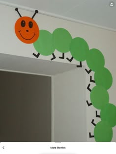 the very hungry caterpillar on the wall is ready to be cut in half