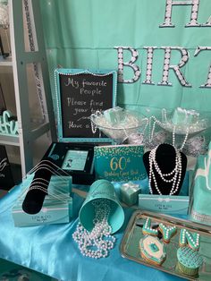 a table topped with lots of jewelry and cakes