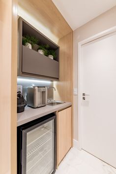 a small kitchen with an oven and refrigerator