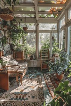 a sun room filled with lots of plants