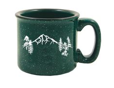 a green coffee mug with mountains and trees on it