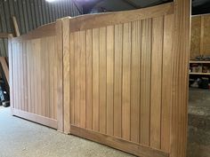 a large wooden gate in a garage