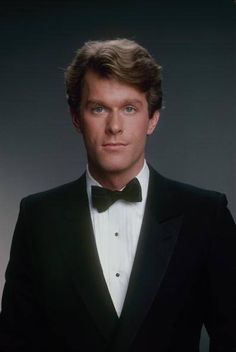 a man in a tuxedo and bow tie