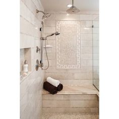 a bathroom with a walk in shower next to a bath tub