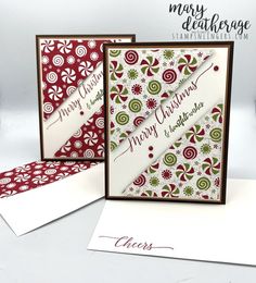 two christmas cards with red and green designs on them, one is folded in white paper