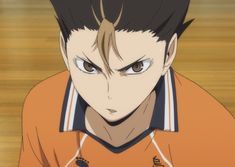 an anime character with brown hair and blue eyes looking at the camera while wearing an orange shirt