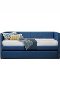 a blue couch with pillows and blankets on it's back end, in front of a white background