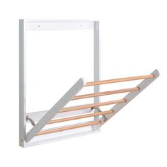 a white rack with wooden rails on it