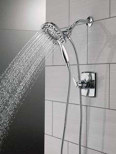 a shower head with the spray coming out of it