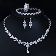 Complete your wedding look with this elegant Bridal Necklace and Earring Jewelry Set. The set is designed to add a touch of sophistication and style to your bridal ensemble, making you shine on your special day.
– This bridal a plus cubic zirconia gemstone necklace set is perfect for adding elegance to any bridal ensemble.– Made with high-quality materials, this set includes a stunning necklace and matching earrings for a complete look.– Perfect for pageant, bridal, bridesmaid, prom, quinceañer Ring And Bracelet, Wedding Necklace Set, Zircon Necklace, Bridal Necklace Set, Bracelet Wedding, Wedding Dress Accessories, Fashion Jewelry Sets, Wedding Bridal Jewellery, Leaf Jewelry