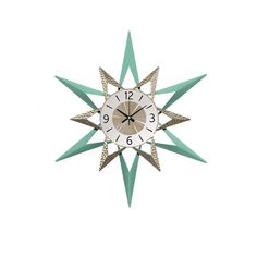 a clock that is on the side of a wall with green and white stars around it