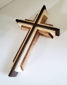 a wooden cross hanging on the wall