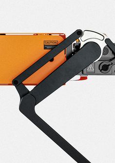 an orange folder with a black handle attached to it's side and the bottom part of its clipping