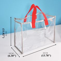 a clear bag with a red ribbon hanging from it