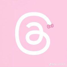 the number six with a pink bow on it's head is in front of a light pink background