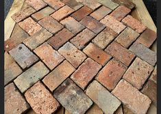 a pile of bricks sitting on top of a wooden table