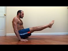 a man is sitting on the floor doing yoga