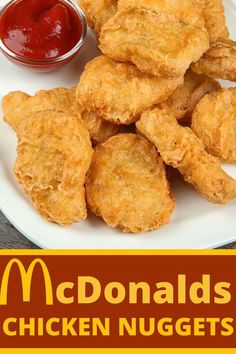 fried chicken nuggets on a white plate with ketchup