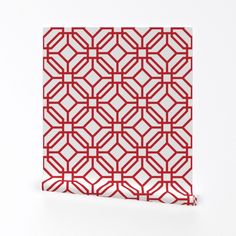 a red and white pattern on a piece of paper that looks like it has been cut out