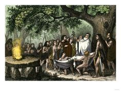 an image of people gathered around a fire in the woods