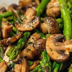 mushrooms and asparagus are mixed together in a dish