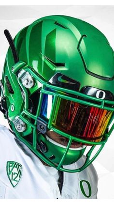 a man wearing a green football helmet and goggles