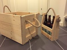 two wooden crates sitting on top of a tiled floor next to each other with beer bottles in them