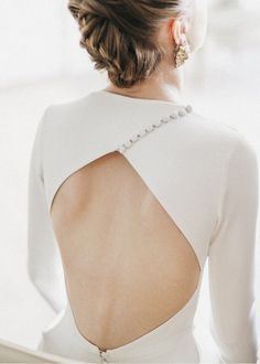 the back of a woman's white dress