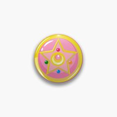 a yellow and pink button with a star on it