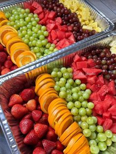 two trays filled with different types of fruit