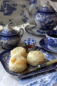 blue and white tea set with scones on plate