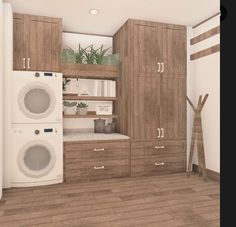 a laundry room with washer and dryer in the corner, next to cabinets