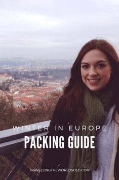 a woman standing on top of a building with the words winter in europe packing guide