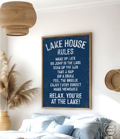 a bed in a bedroom with a blue sign above it that says lake house rules