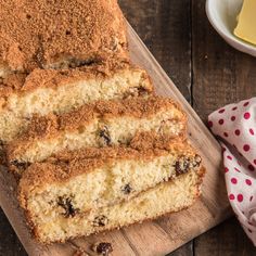 slices of cake sitting on top of a wooden cutting board