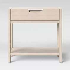 the side table is made from wood and has a drawer on one end, with an open drawer at the top