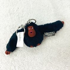 Brand New. Kipling Monkey Key Chain, "Davina." Black With Brown Face & Hands; Pink Lips. Silver Chain & Key Ring. Monkey Is 6 1/4" Long (Finger Tip To Finger Tip). Body = 1 3/4" Wide X 2" Tall. Chain = 1 1/4" Long + Ring = 1" Diameter. From Illness/Smoke/Pet-Free Home. Select Other Items From My Closet, Bundle In 1 Order & Save On Shipping! Kipling Monkey, Long Ring, Key Card Holder, Pink Lips, Key Ring, Key Chain, Silver Chain, Black And Brown, Lips