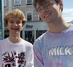 two young men standing next to each other