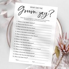 a printable question card on a plate next to a flower and ribbon with the words, what did the groom say?